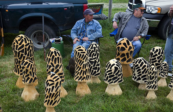 Men selling carved mushrooms, Animal Swap Meet, Ligonier