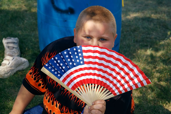 Boy with patriotic fan, Victory City Festival, Kingsford Heights